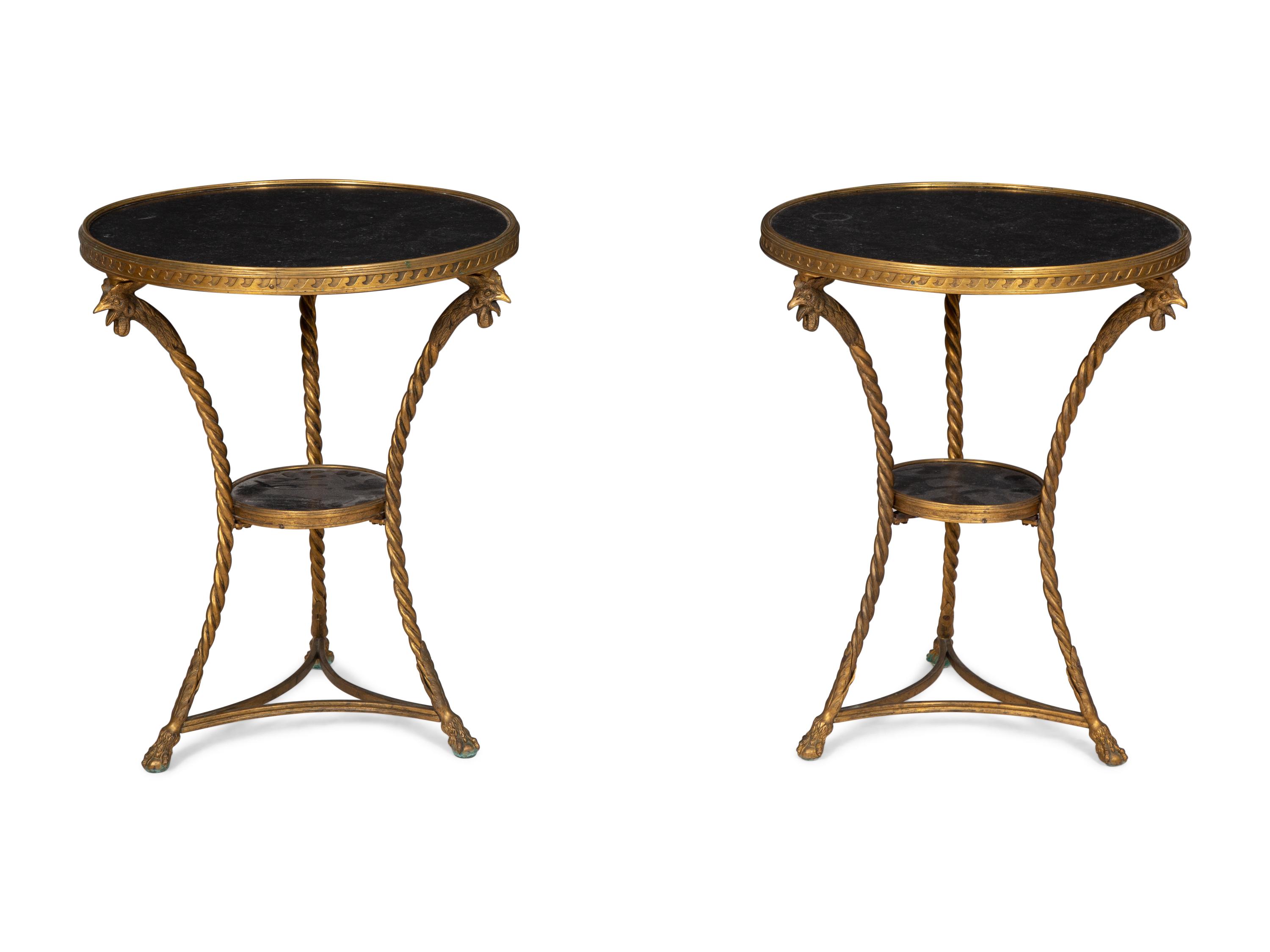 A Pair of French Neoclassical Gilt Bronze Gueridons with Inset Black Marble Tops