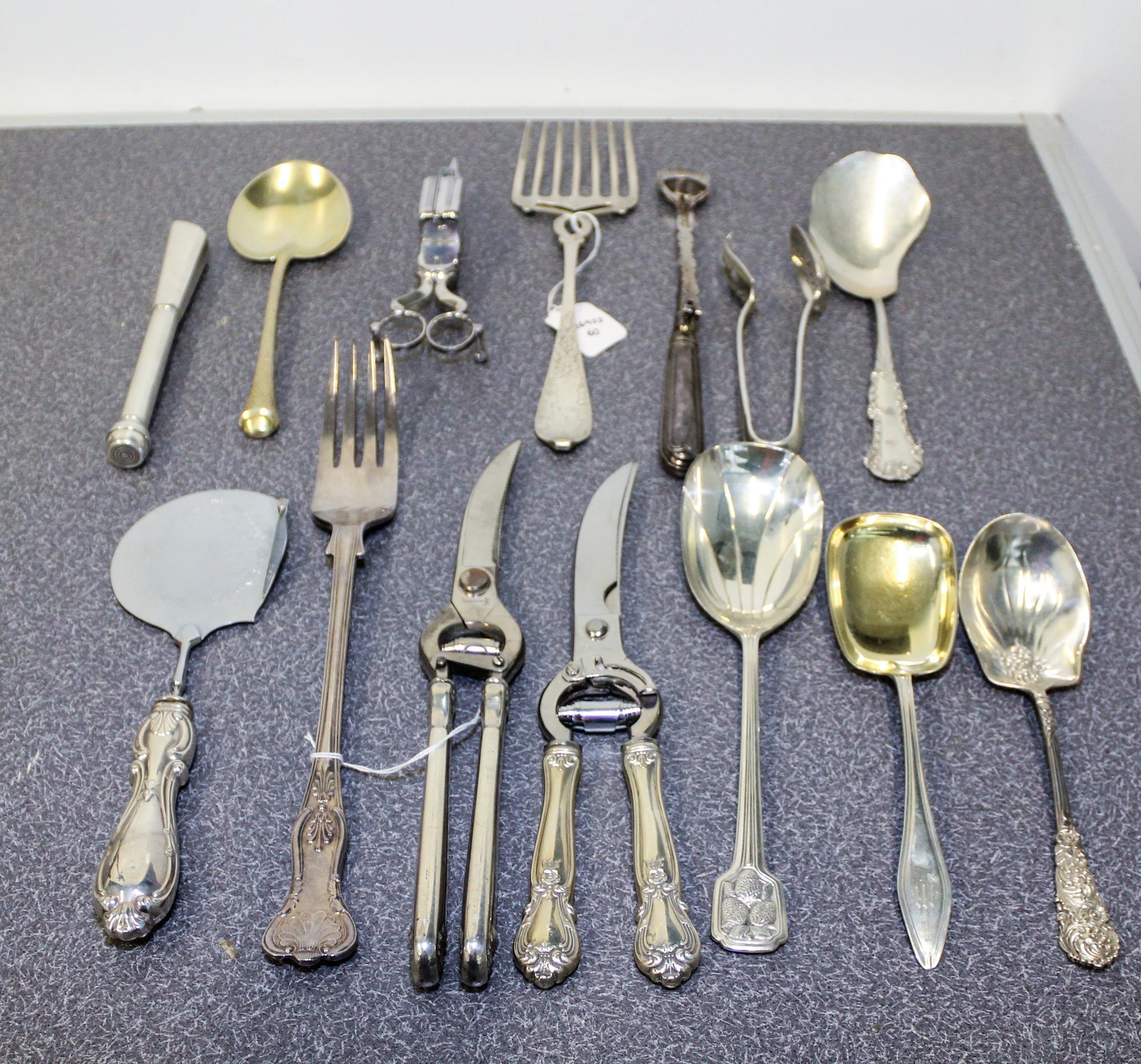 A Collection of Silver and Silver-Plate Serving and Table Articles Length of longest 12 3/4 inches.