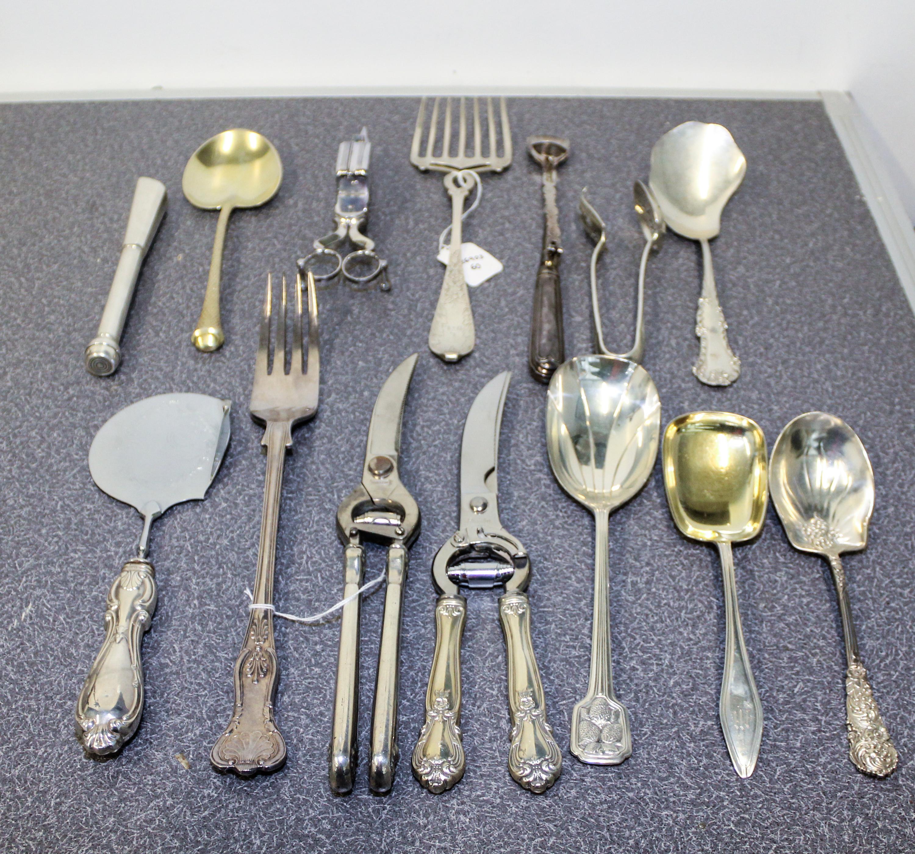 A Collection of Silver and Silver-Plate Serving and Table Articles Length of longest 12 3/4 inches.