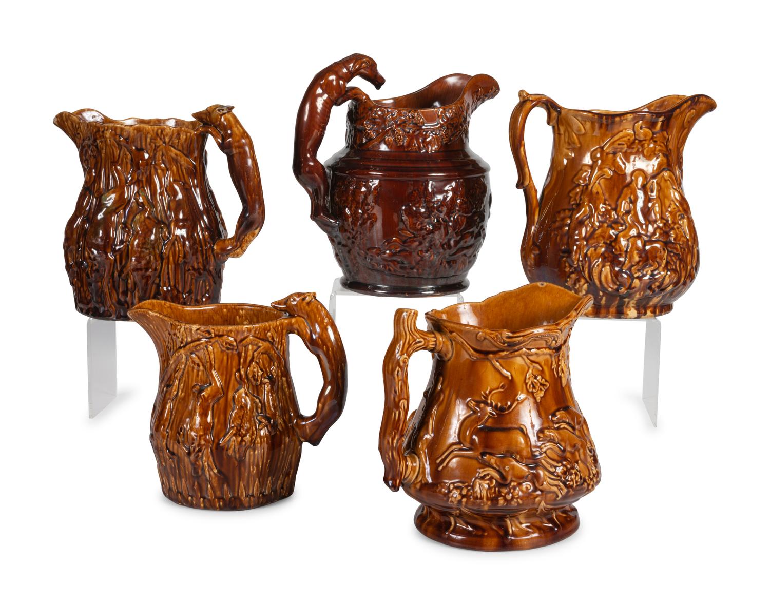 Five Rockingham Glaze Water Pitchers