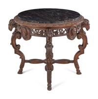 An Italian Carved Walnut Marble-Top Table