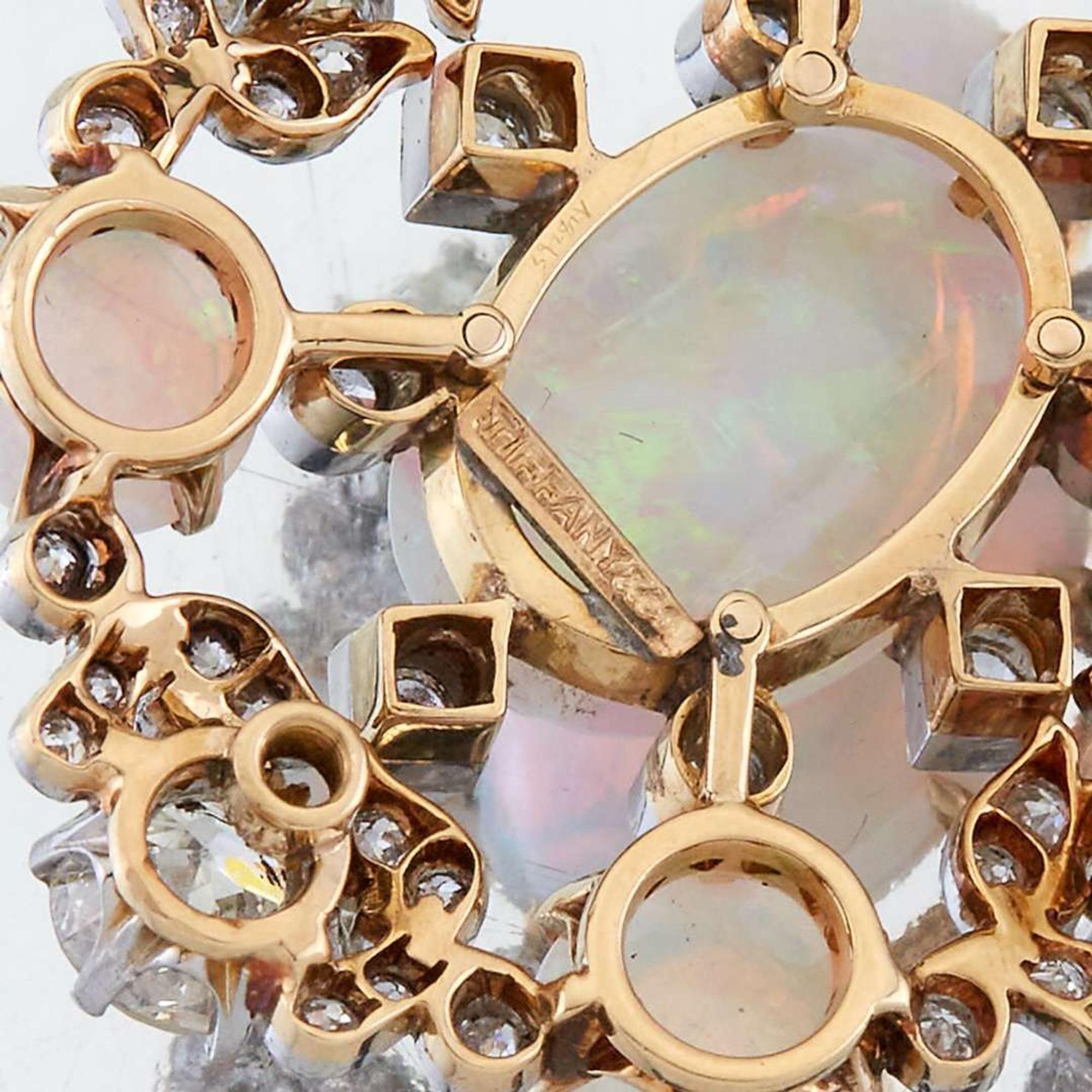 An opal, diamond, and eighteen karat gold pendant, Tiffany & Co.