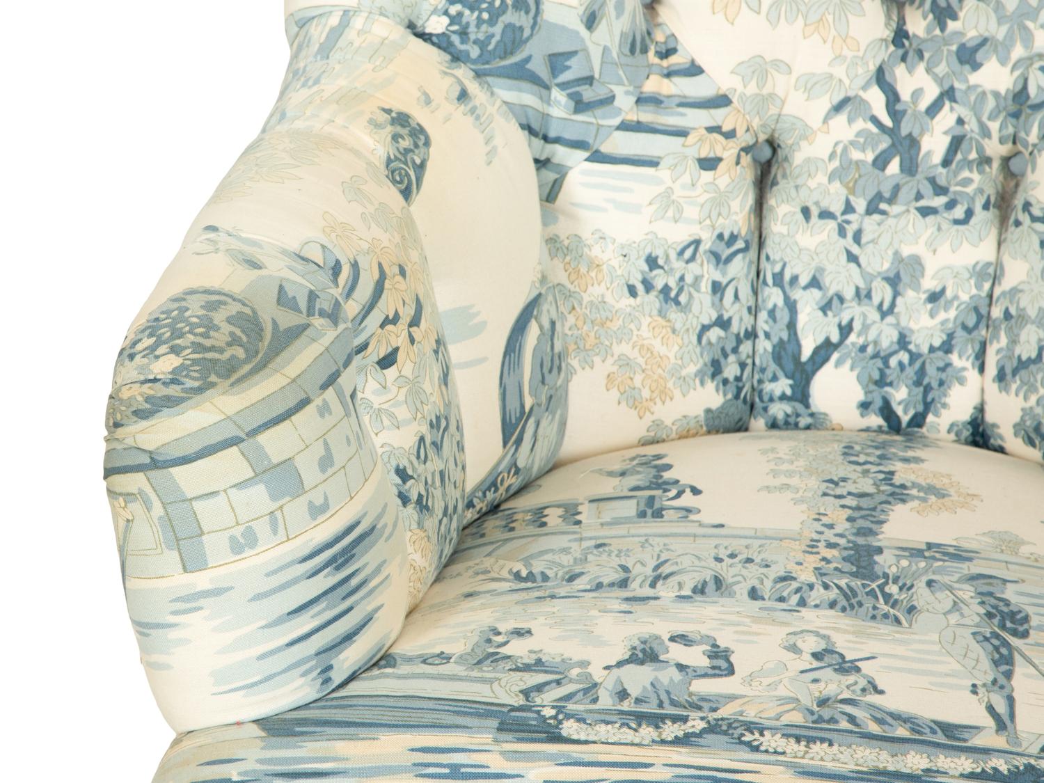 A Blue, White and Cream Upholstered Club Chair and Ottoman