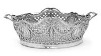 A German Silver Basket, Likely Hanau Maker, 19th Century, having an openwork lattice decorated body with foliate and ribbon festooning