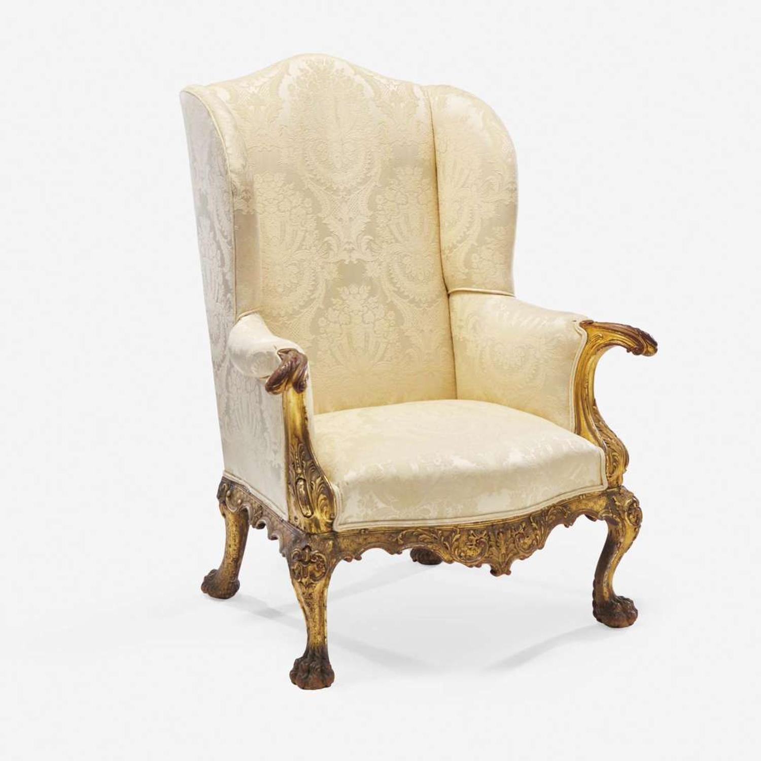 A Chippendale style carved and gilt open arm chair in the French manner American, circa 1875