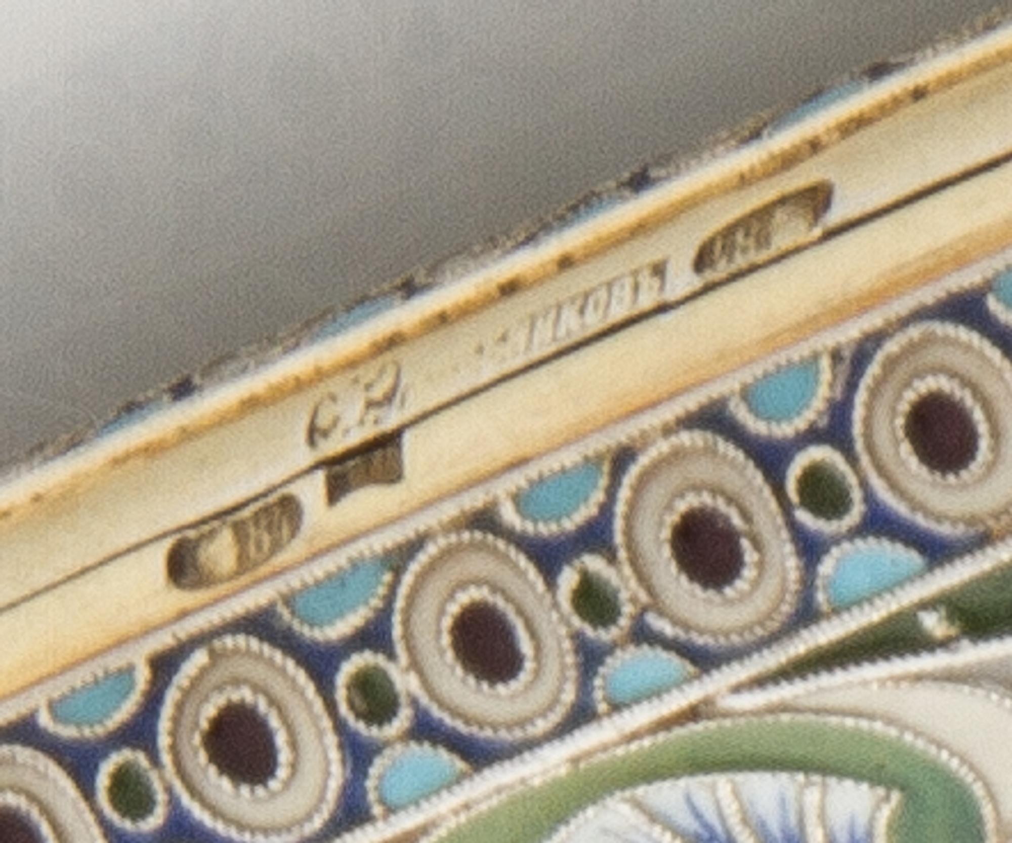 A Russian Enameled Silver Cigarette Case, Mark of I.P. Khlebinikov with Imperial Warrant, Moscow, 19th century, the case having a gilt