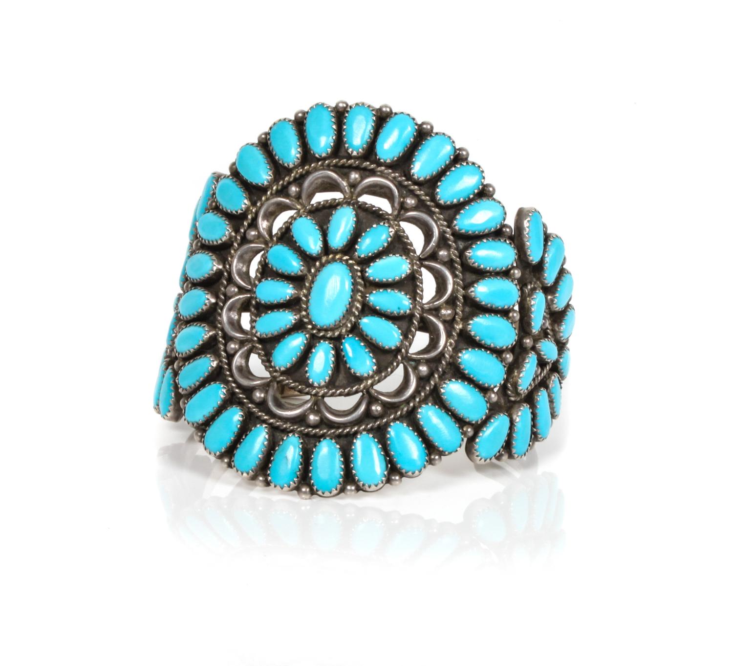 A Zuni Silver and Turquoise Petit Point Cluster Bracelet Length 6 x opening 1 1/4 x width 3 inches.