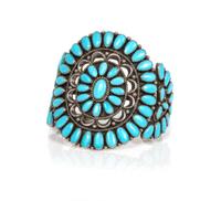 A Zuni Silver and Turquoise Petit Point Cluster Bracelet Length 6 x opening 1 1/4 x width 3 inches.