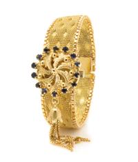 An 18 Karat Yellow Gold and Sapphire Surprise Wristwatch, Nava, 28.40 dwts.