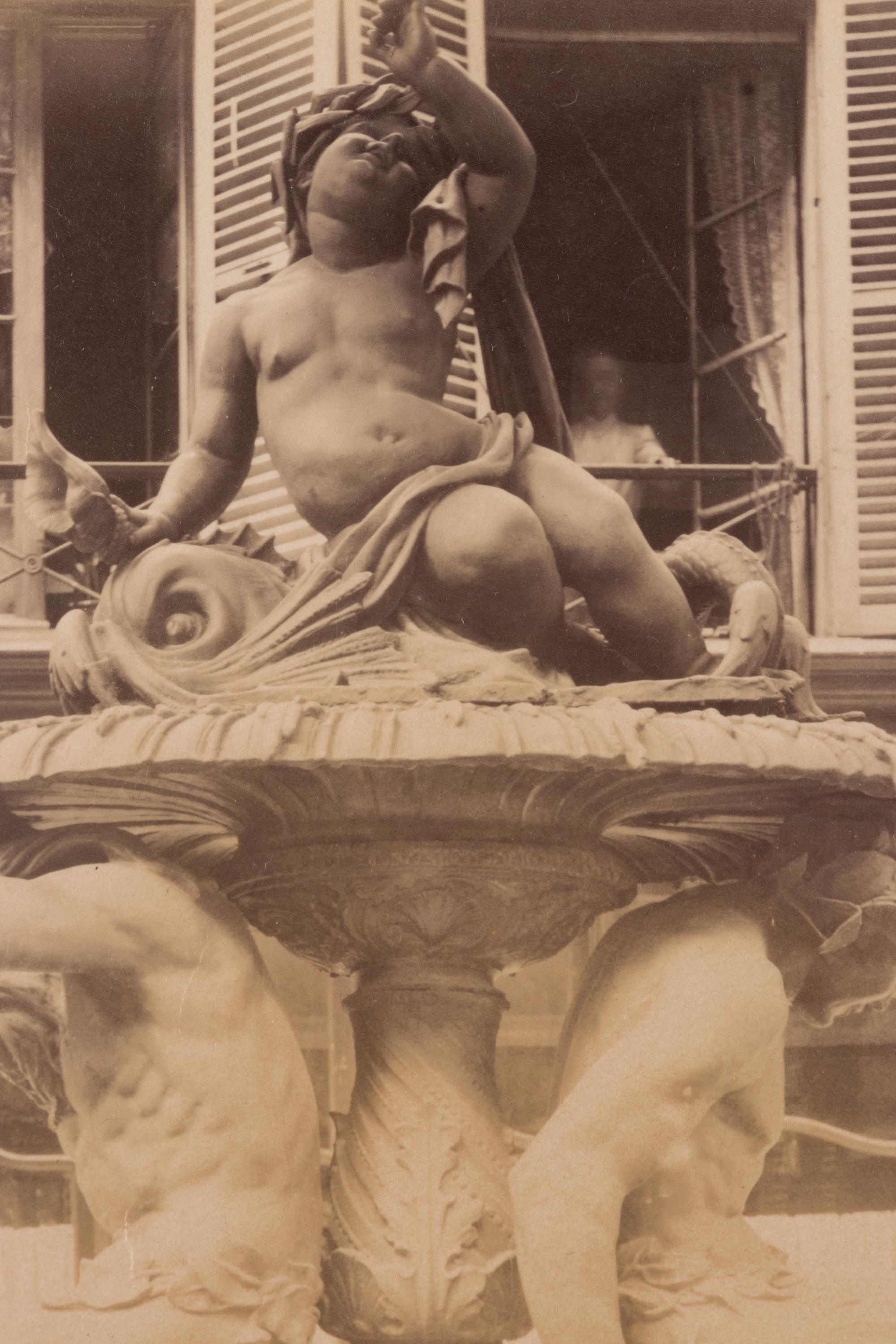 A group of four photographs ( Untitled [man at fountain], circa 1900s; Boutique empire, 14 rue de Grammont , 1903-1904; Hôtel de Neuville, rue Alphonse de Neuville, 1905-1906; Fontaine, faubourg Saint-Martin, 1912)