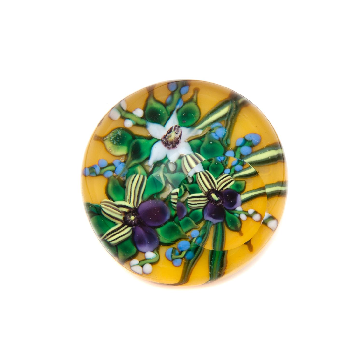 Attributed to Debbie Tarsitano, (Italian/American, b.1955), three petal flower miniature paperweight, on yellow ground