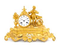 A French Gilt Metal Figural Mantel Clock Height 10 inches.