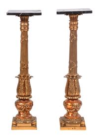 A Pair of Gilt Metal and Black Marble Top Pedestals Height 39 inches.