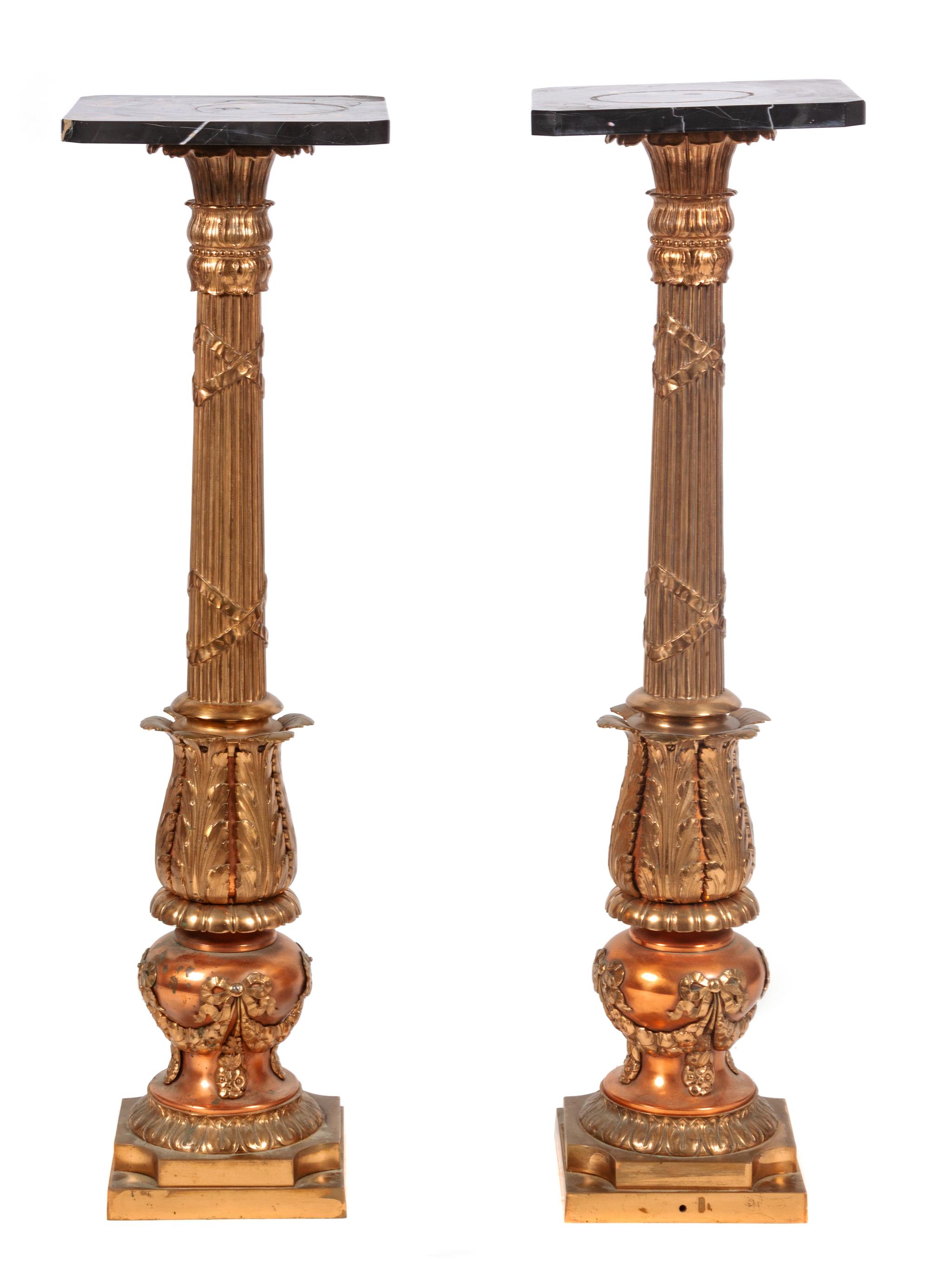 A Pair of Gilt Metal and Black Marble Top Pedestals Height 39 inches.