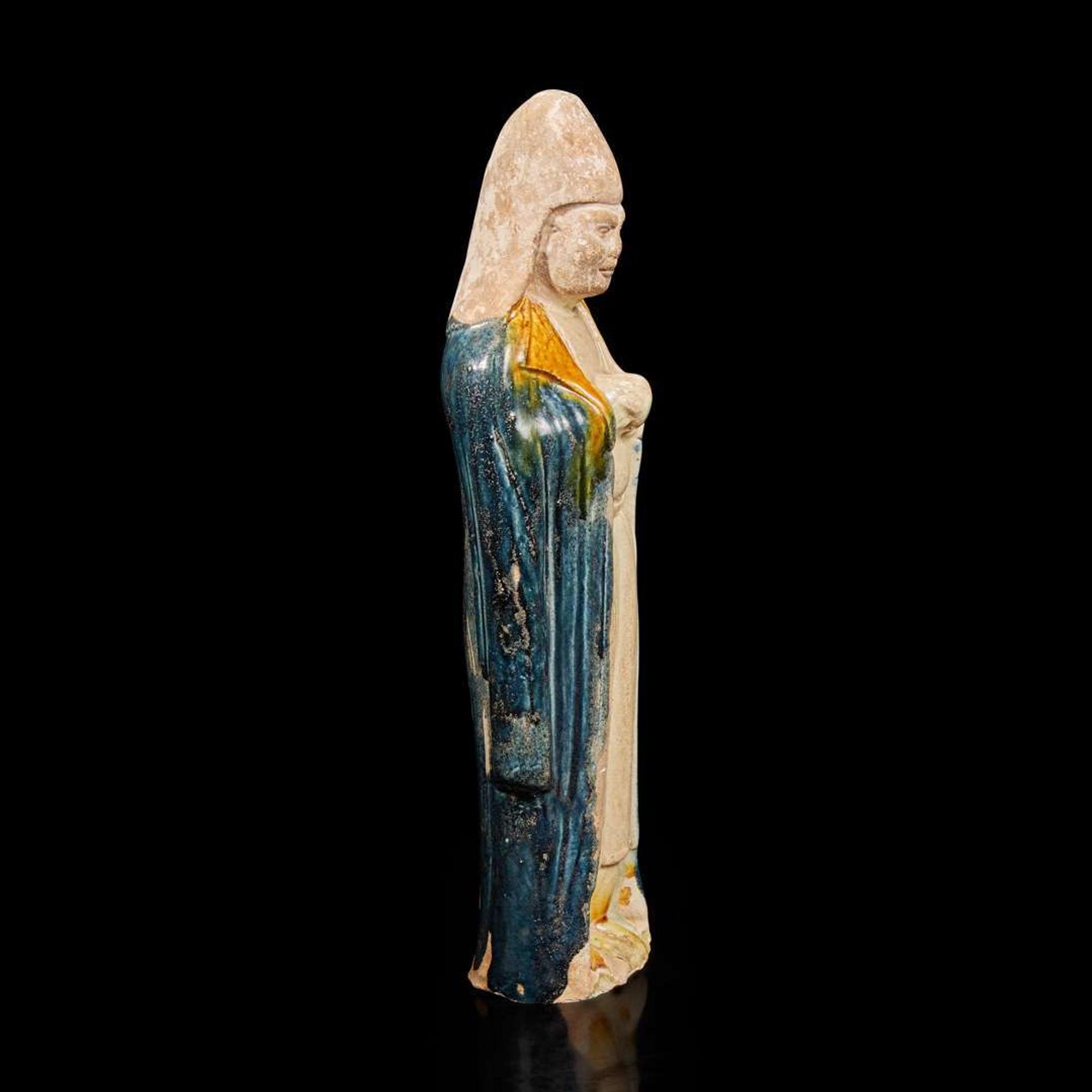 A Chinese sancai-glazed pottery attendant 三彩人物塑像 Possibly Tang dynasty ????