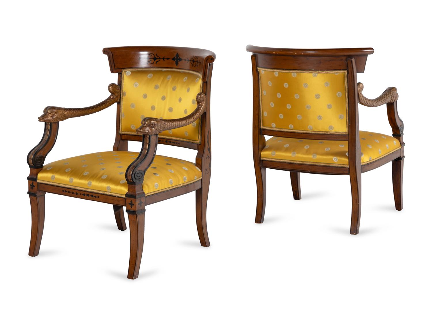 A Pair of Charles X Style Parcel-Gilt and Part Ebonized Armchairs