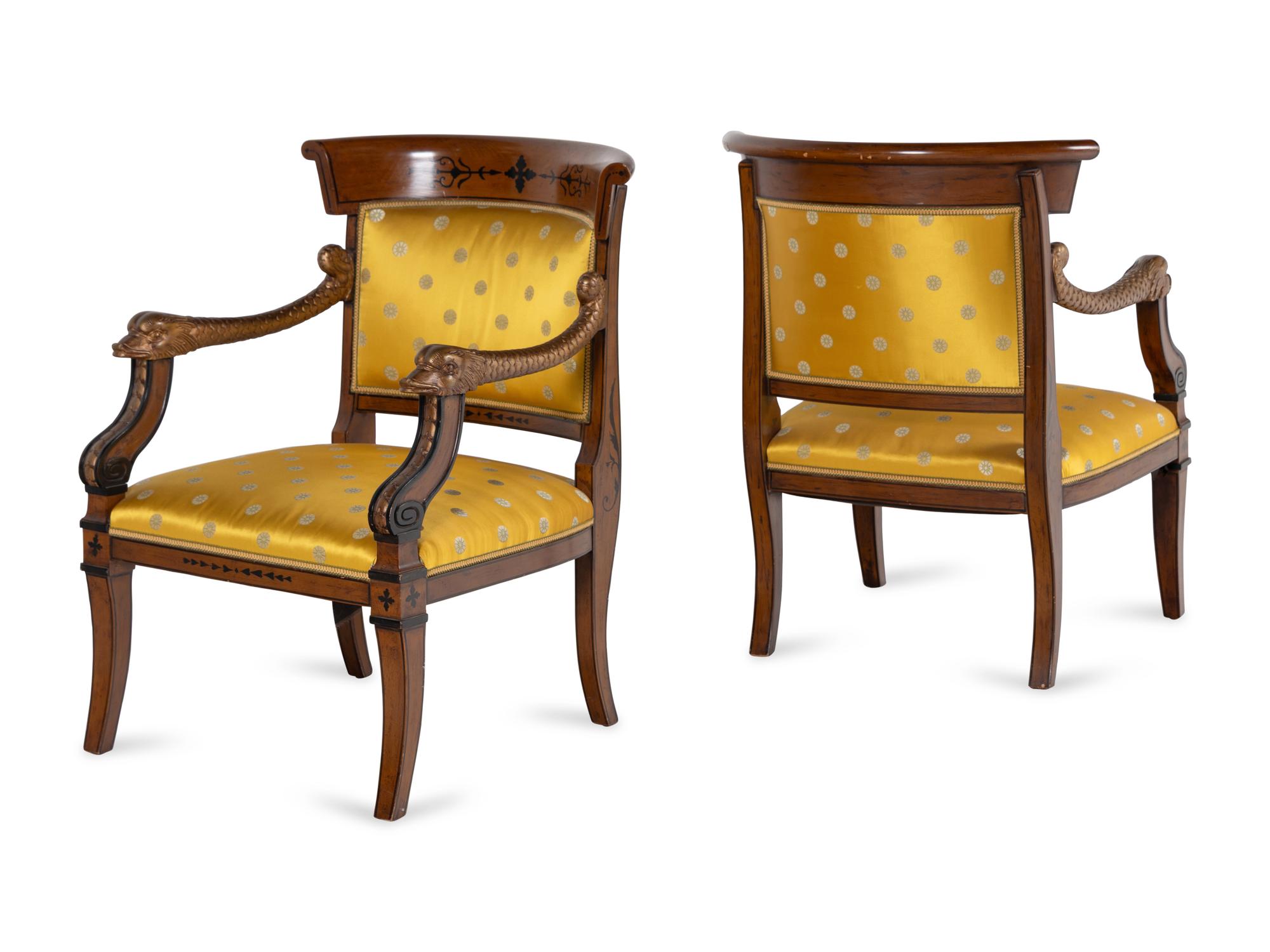 A Pair of Charles X Style Parcel-Gilt and Part Ebonized Armchairs