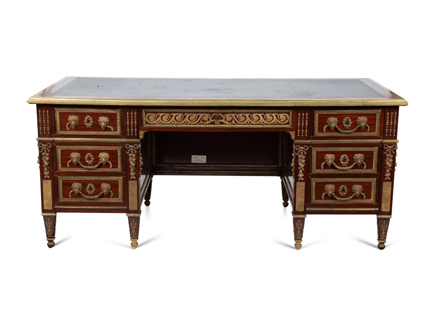 A Louis XVI Style Gilt Bronze Mounted Mahogany Desk — EARLY 20TH CENTURY