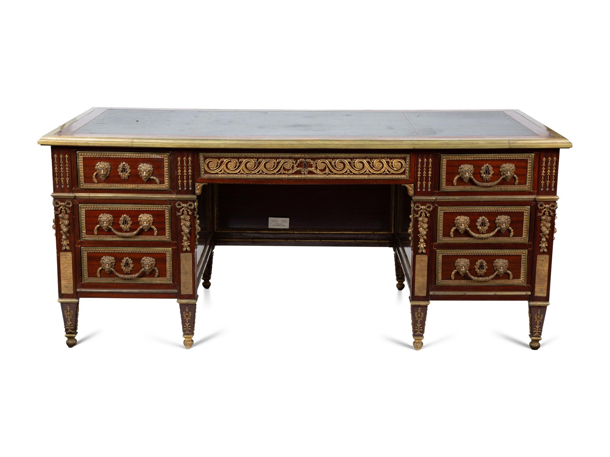 A Louis XVI Style Gilt Bronze Mounted Mahogany Desk — EARLY 20TH CENTURY