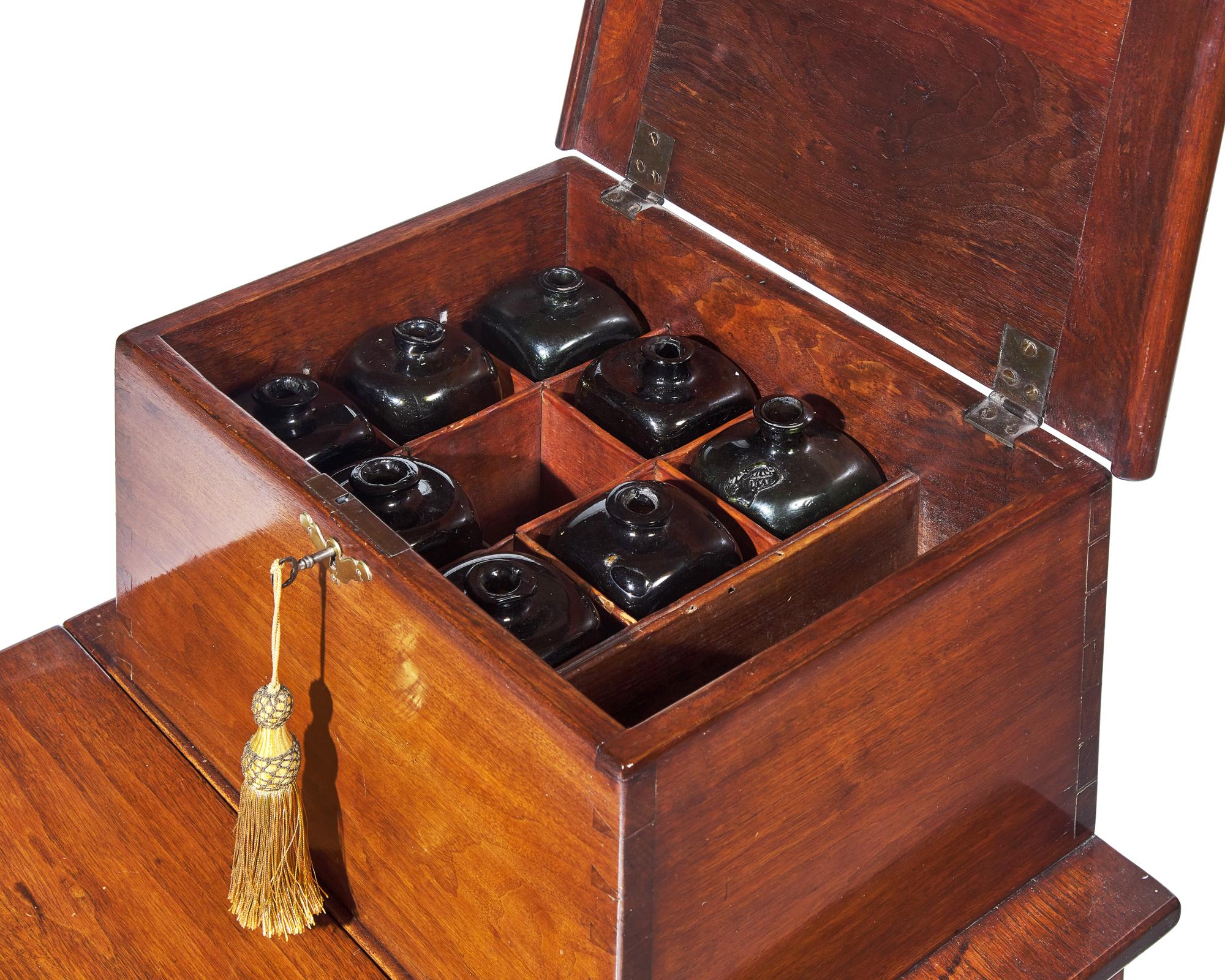 A Queen Anne Walnut Bottle Case on Stand with Drop Leaf