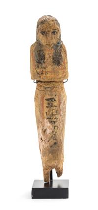 An Egyptian Polychrome Painted Wood Shabti. Height 7 inches.