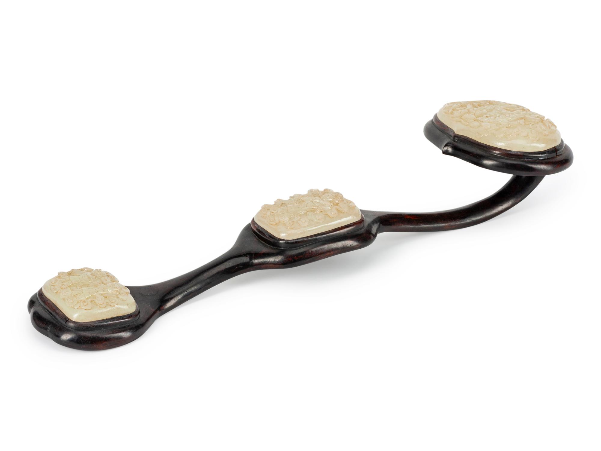 A Chinese Carved Jade and Rosewood Ruyi Scepter