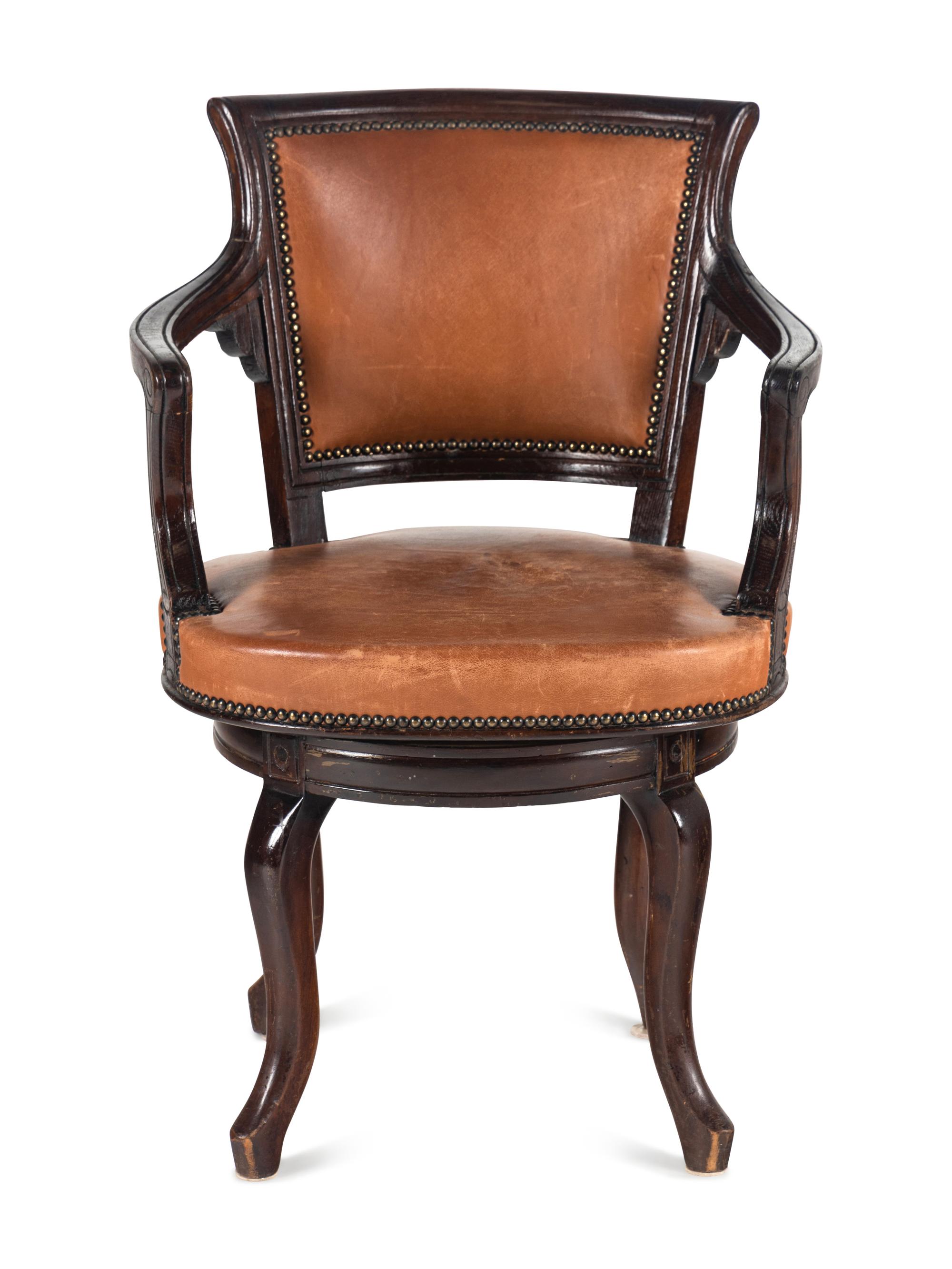 A Directoire Style Leather-Upholstered Swiveling Armchair