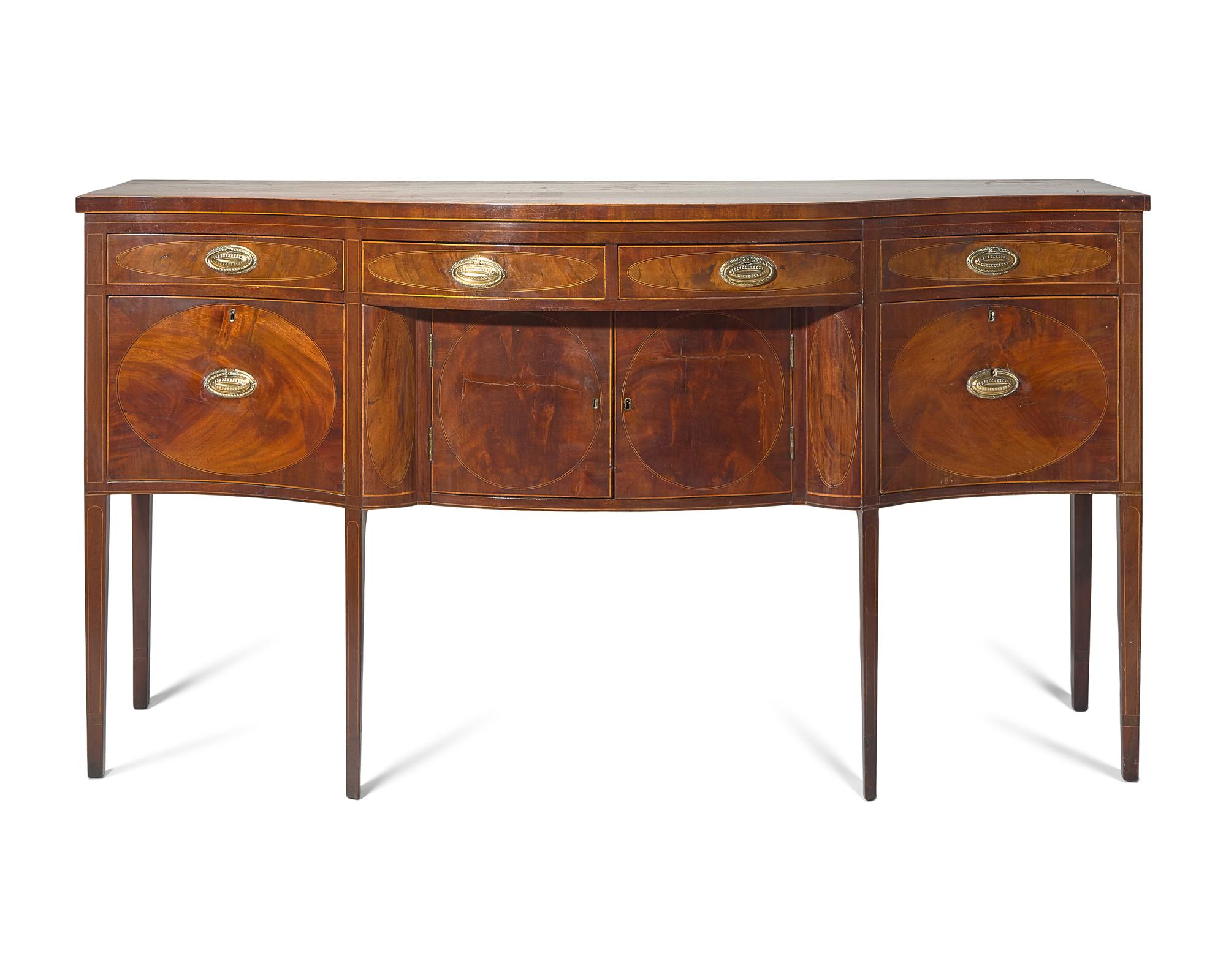 A Federal Inlaid and Figured Mahogany Serpentine Front Sideboard, New York, NY, Circa 1800