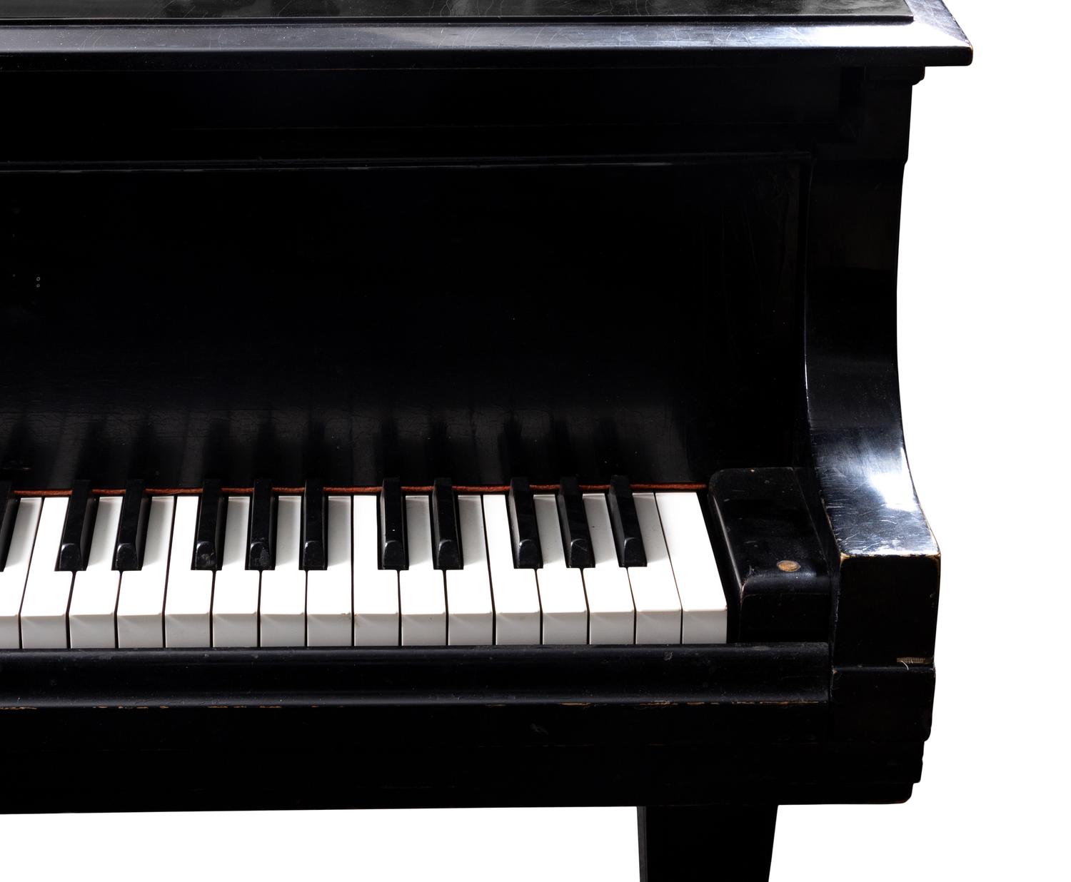A Steinway and Sons Model L Black Lacquer Baby Grand Piano