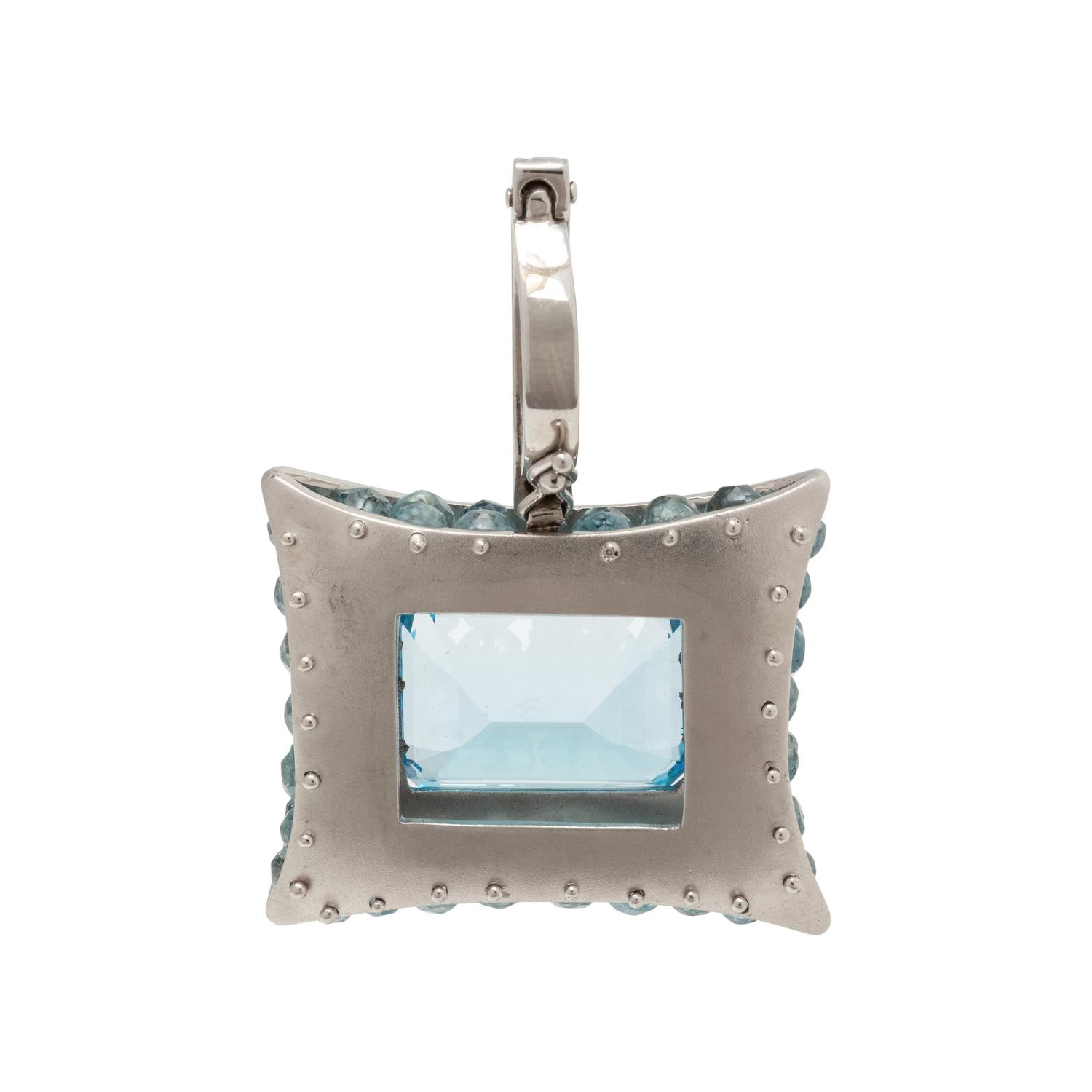 PLATINUM, BLUE TOPAZ AND DIAMOND PENDANT