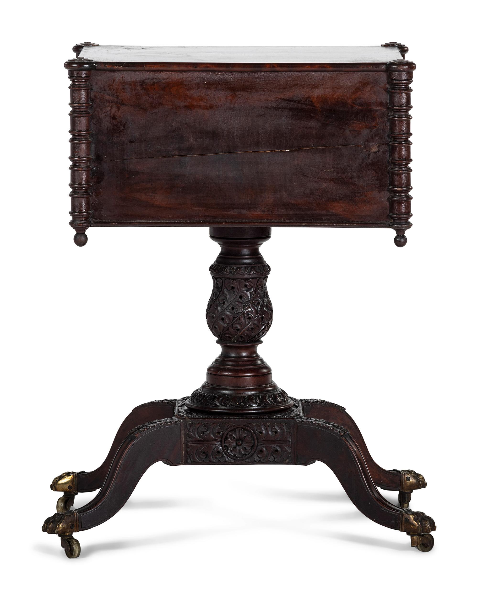 A Classical Carved and Figured Mahogany Pressed Glass Mounted Two-Drawer Work Stand