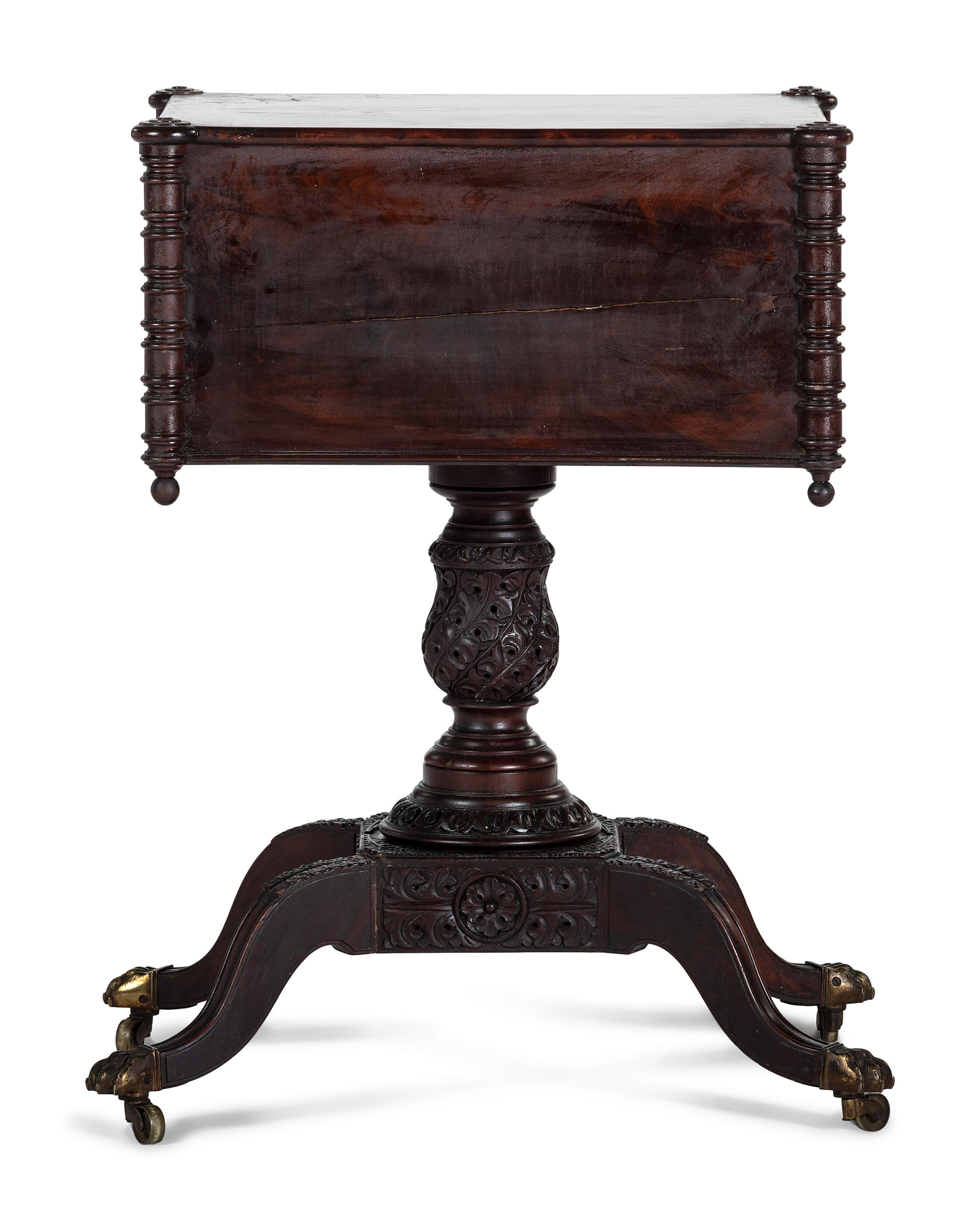 A Classical Carved and Figured Mahogany Pressed Glass Mounted Two-Drawer Work Stand