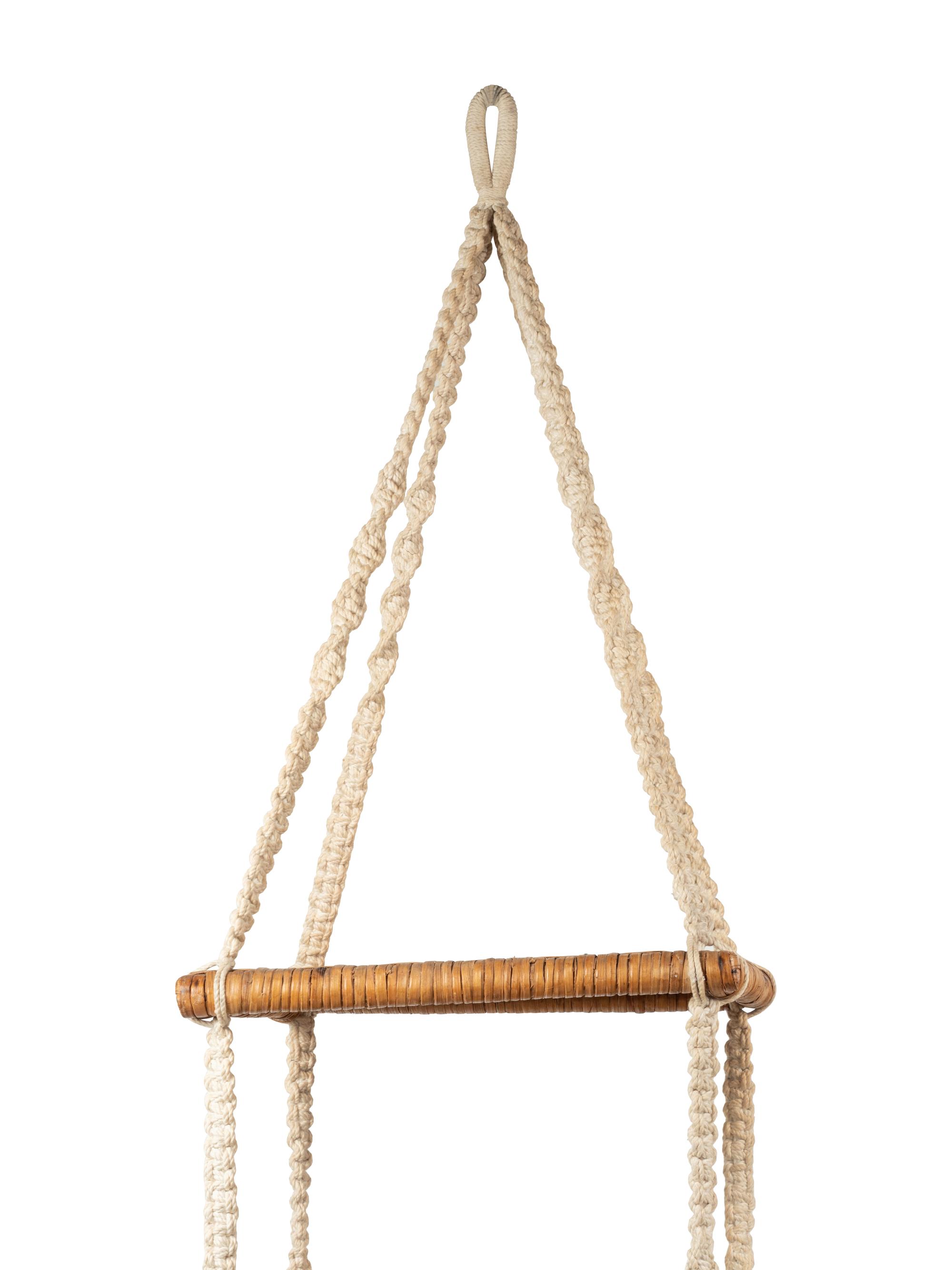 A Three-Tier Cord and Rattan Hanging Shelf Unit