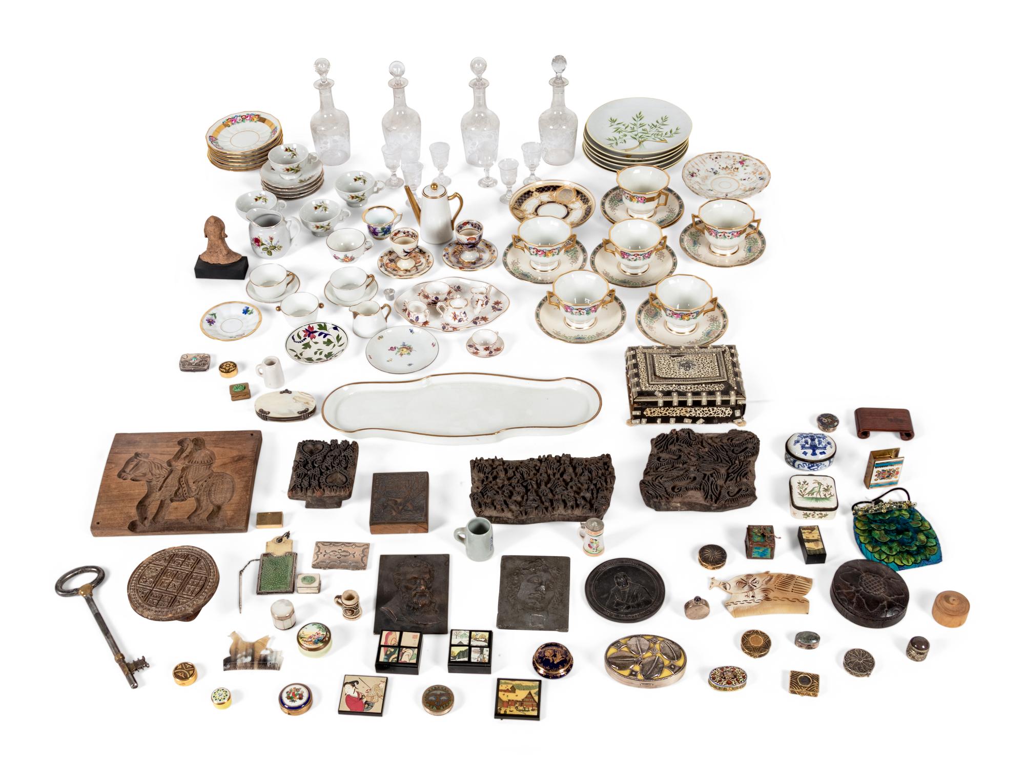 A Box Lot Containing a Collection of Wooden Molds, Porcelain Articles, and a Set of Glass Decanters with Cordials