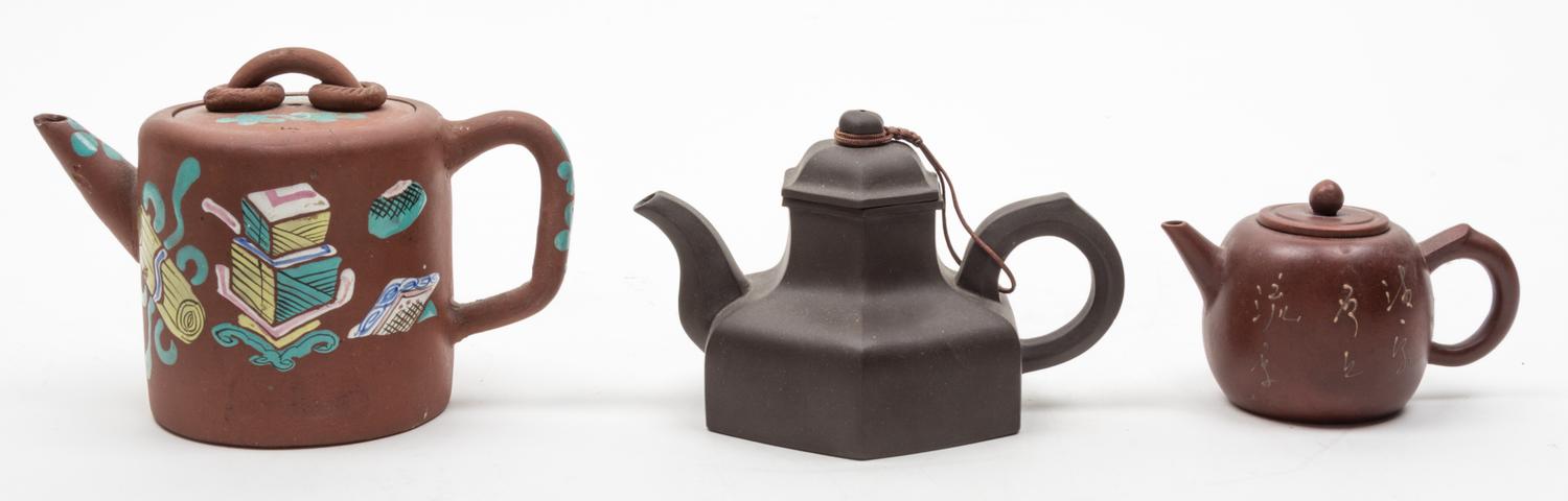 Three Yixing Pottery Teapots Diameter of largest 4 inches.