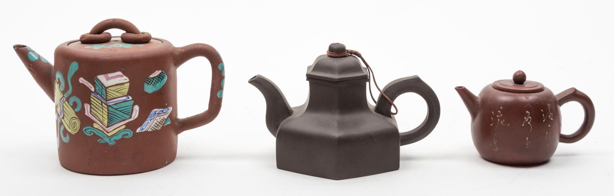 Three Yixing Pottery Teapots Diameter of largest 4 inches.