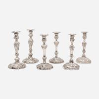 Three pairs of George III / Victorian weighted sterling silver candlesticks in the Rococo manner Various makers, Sheffield, dates ranging 1818-1846