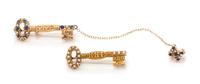 A Collection of Yellow Gold, Seed Pearl and Sapphire Kappa Kappa Gamma Sorority Pins, 4.40 dwts.