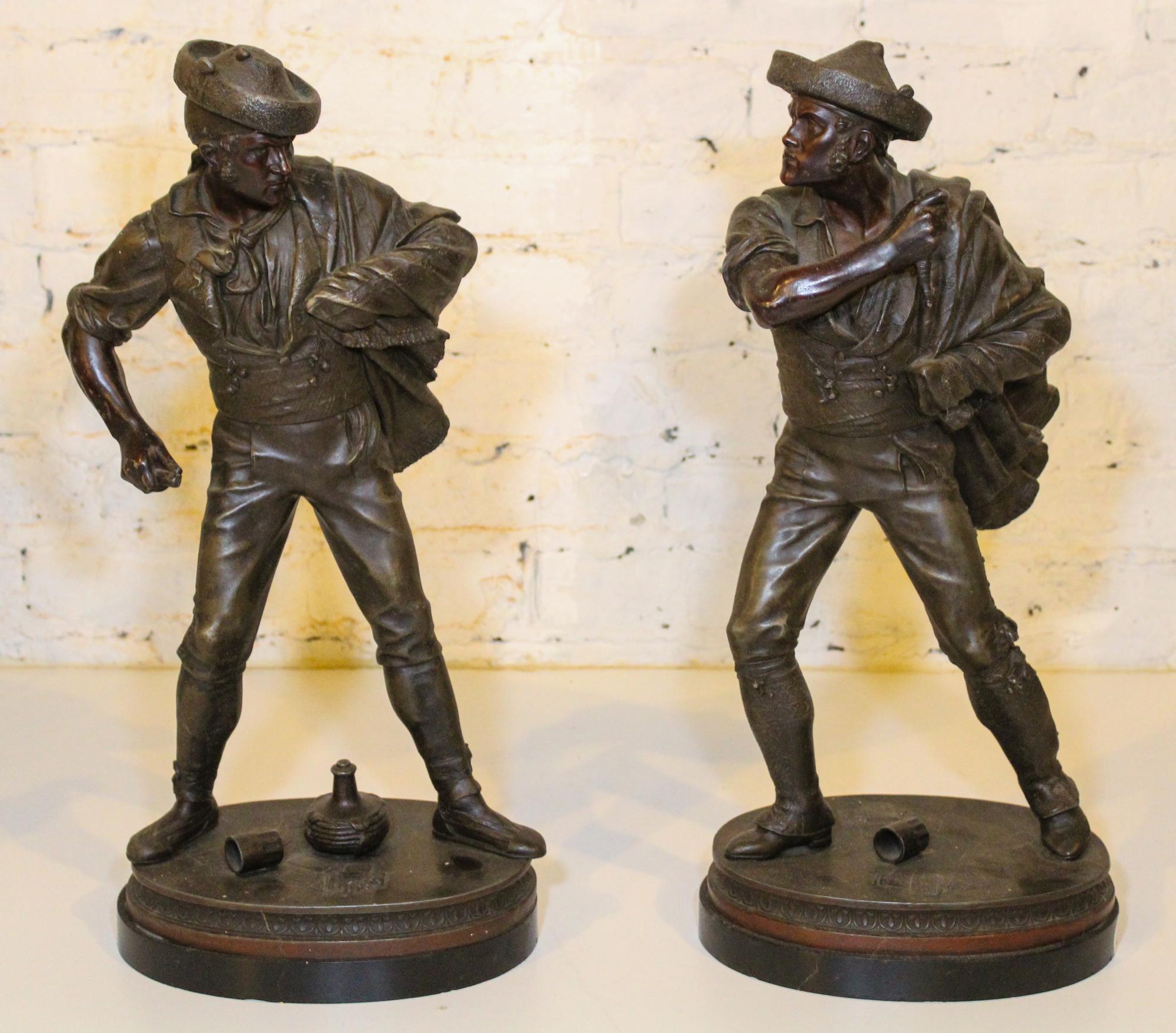 A Pair of Continental Cast Metal Figures. Height 20 3/4 inches.