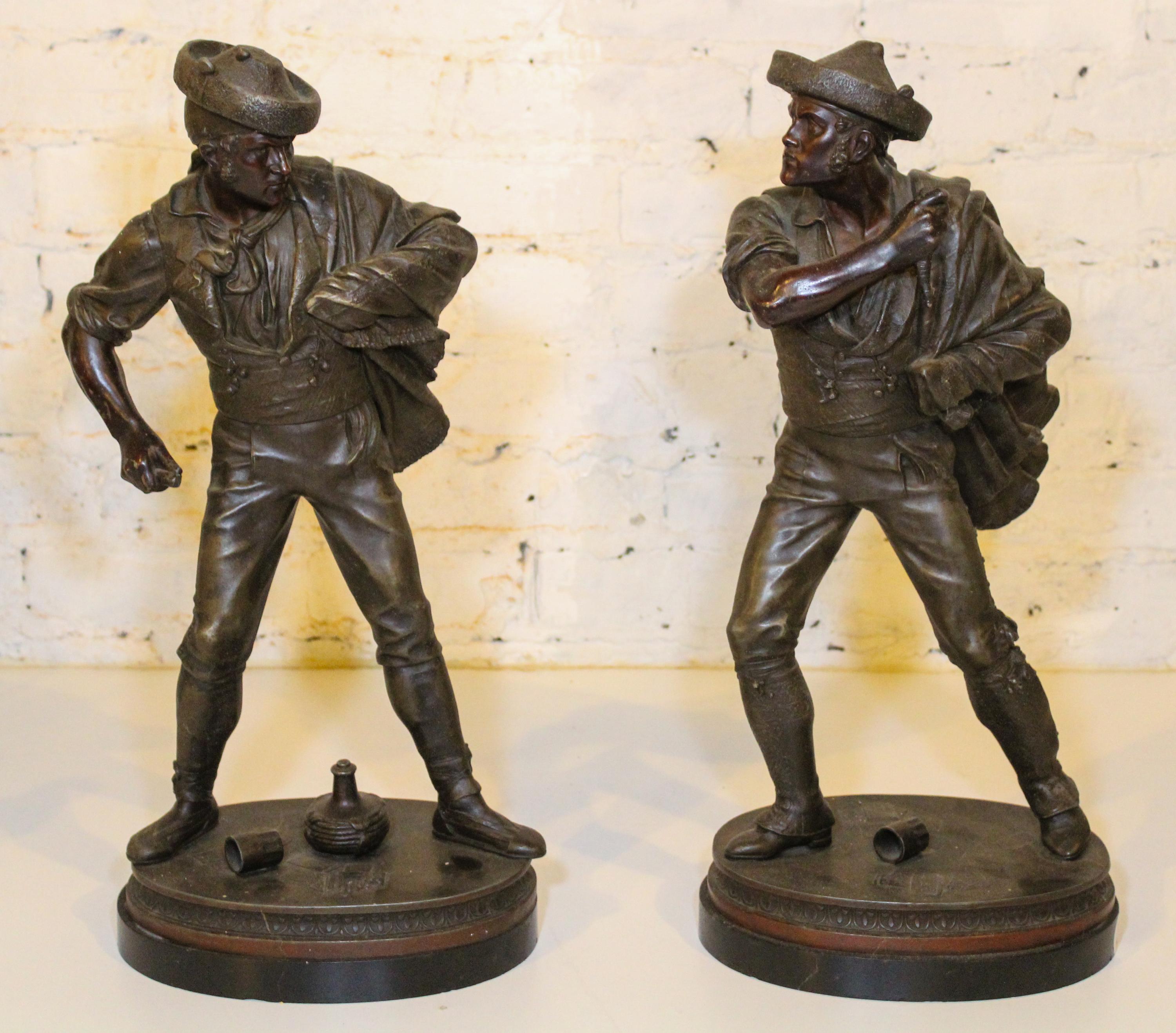 A Pair of Continental Cast Metal Figures. Height 20 3/4 inches.