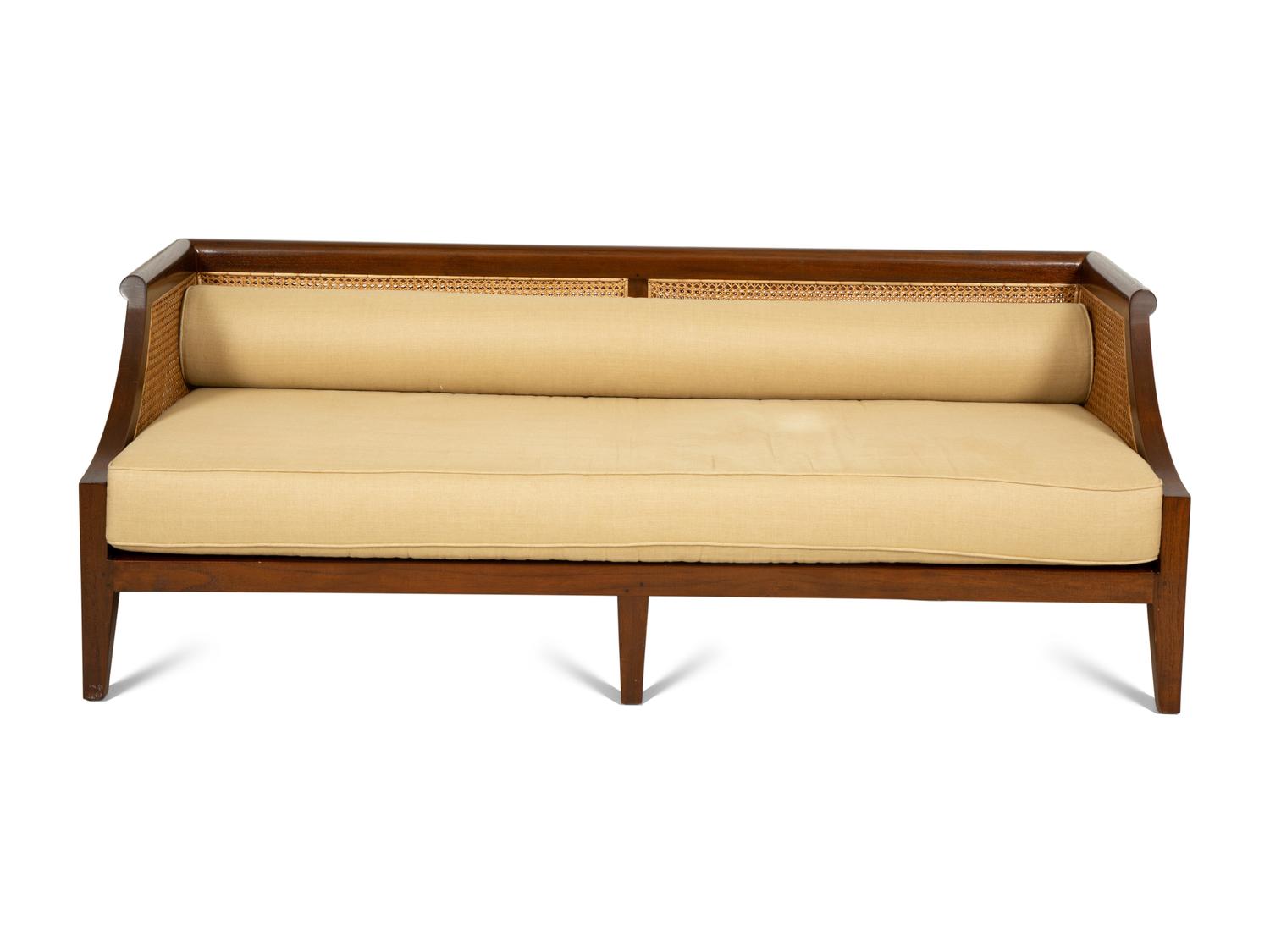 A Contemporary Walnut and Cane Daybed