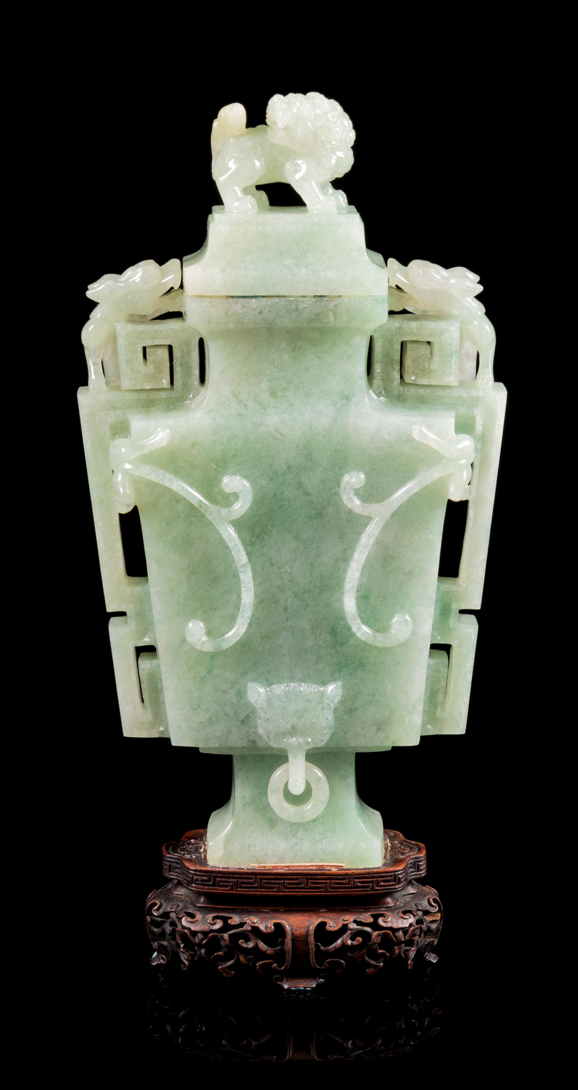 An Apple Green and Pale Celadon Jadeite Covered Vase Height 9 1/2 icnhes. — 19TH/EARLY 20TH CENTURY