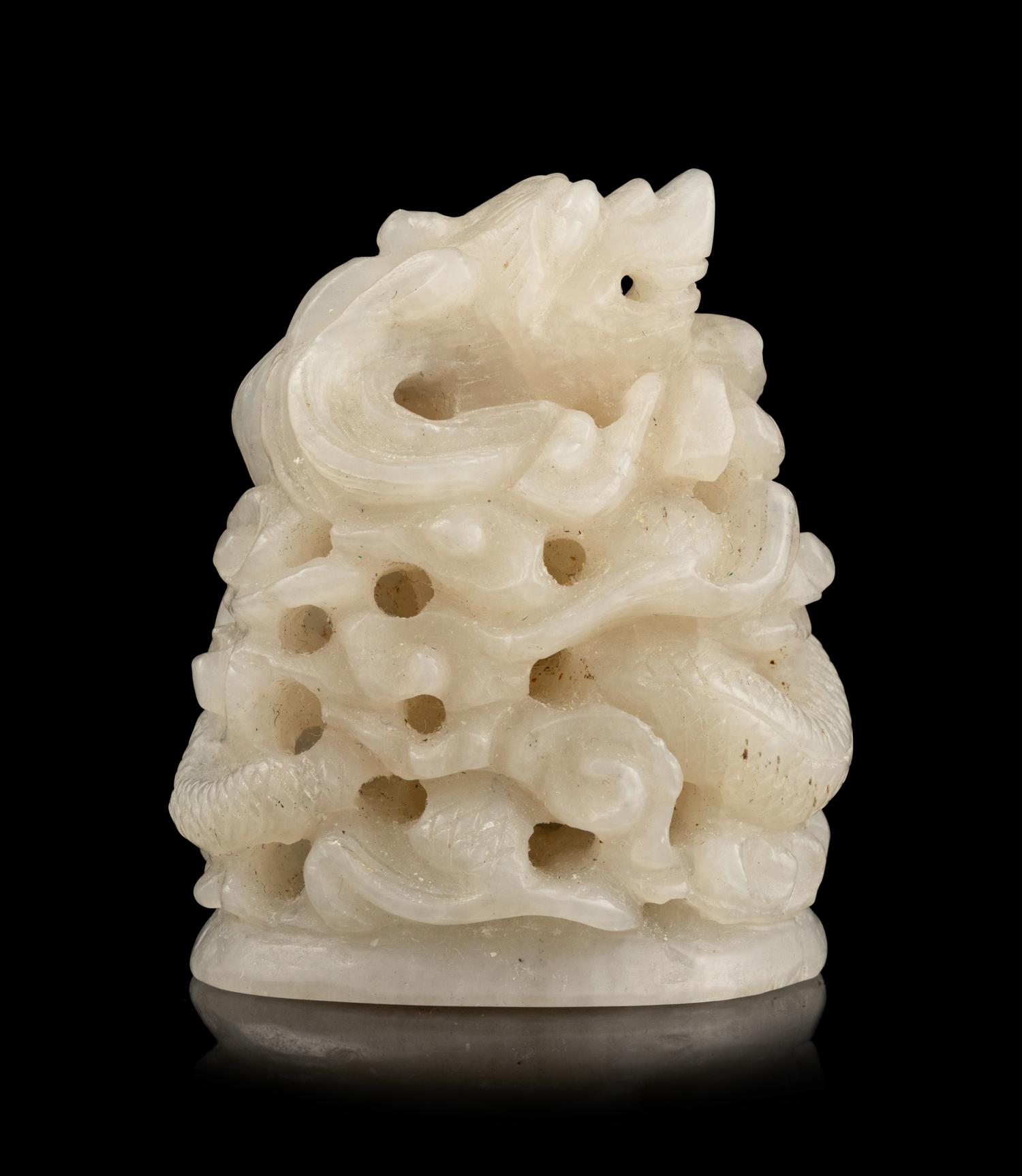 A Chinese Carved White Jade Finial