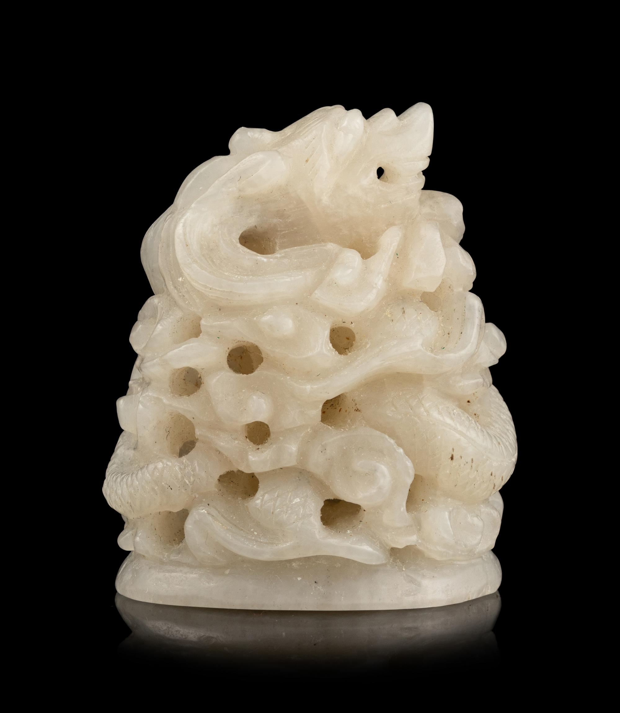 A Chinese Carved White Jade Finial