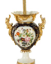 A Pair of French Porcelain Urns Mounted as Lamps