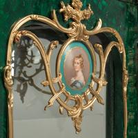 A Pair of Louis XV Style Gilt Bronze and Porcelain Mounted Malachite Cabinets