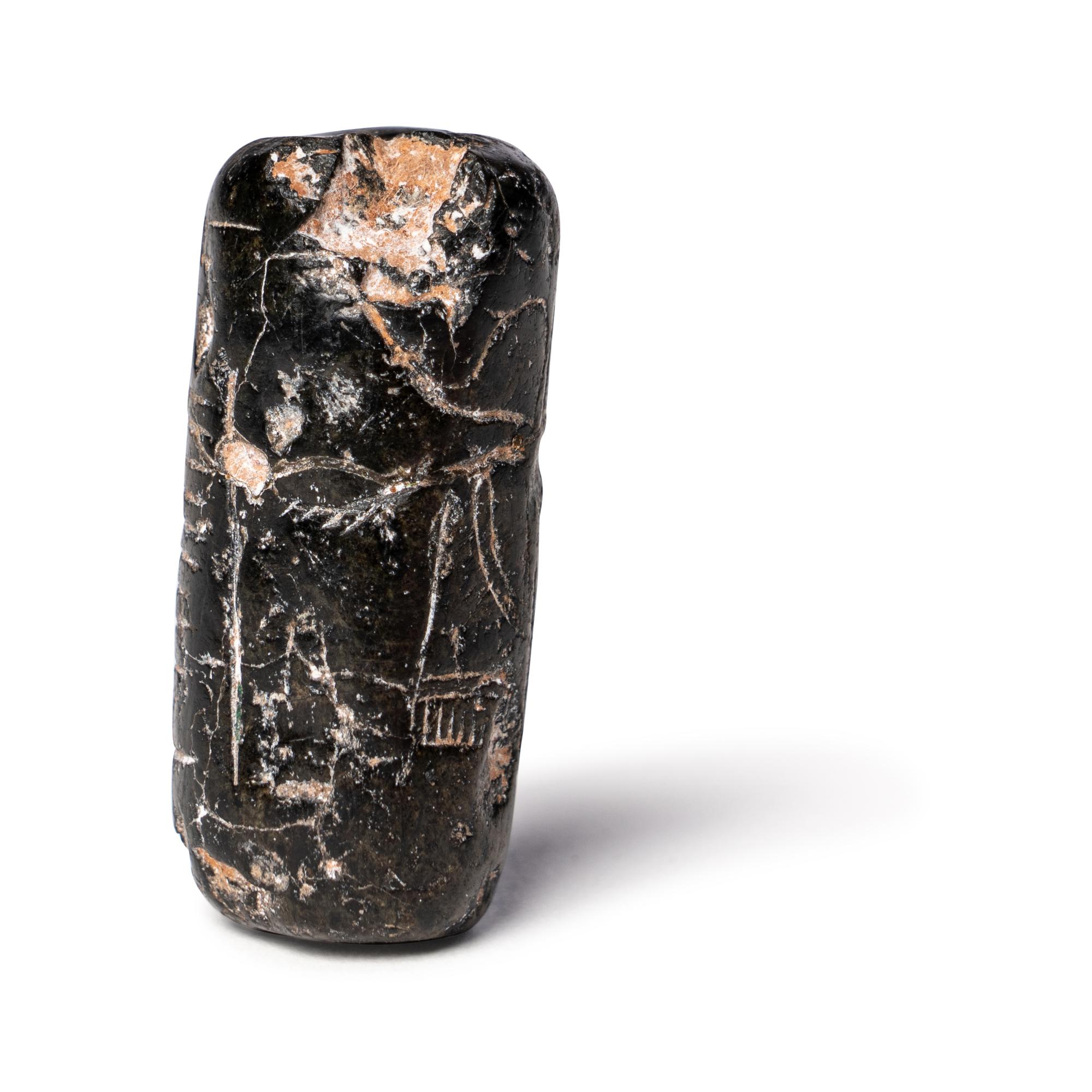 A Mesopotamian Black Steatite Cylinder Seal