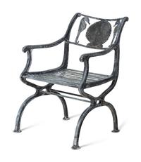 Four Wrought Iron Armchairs