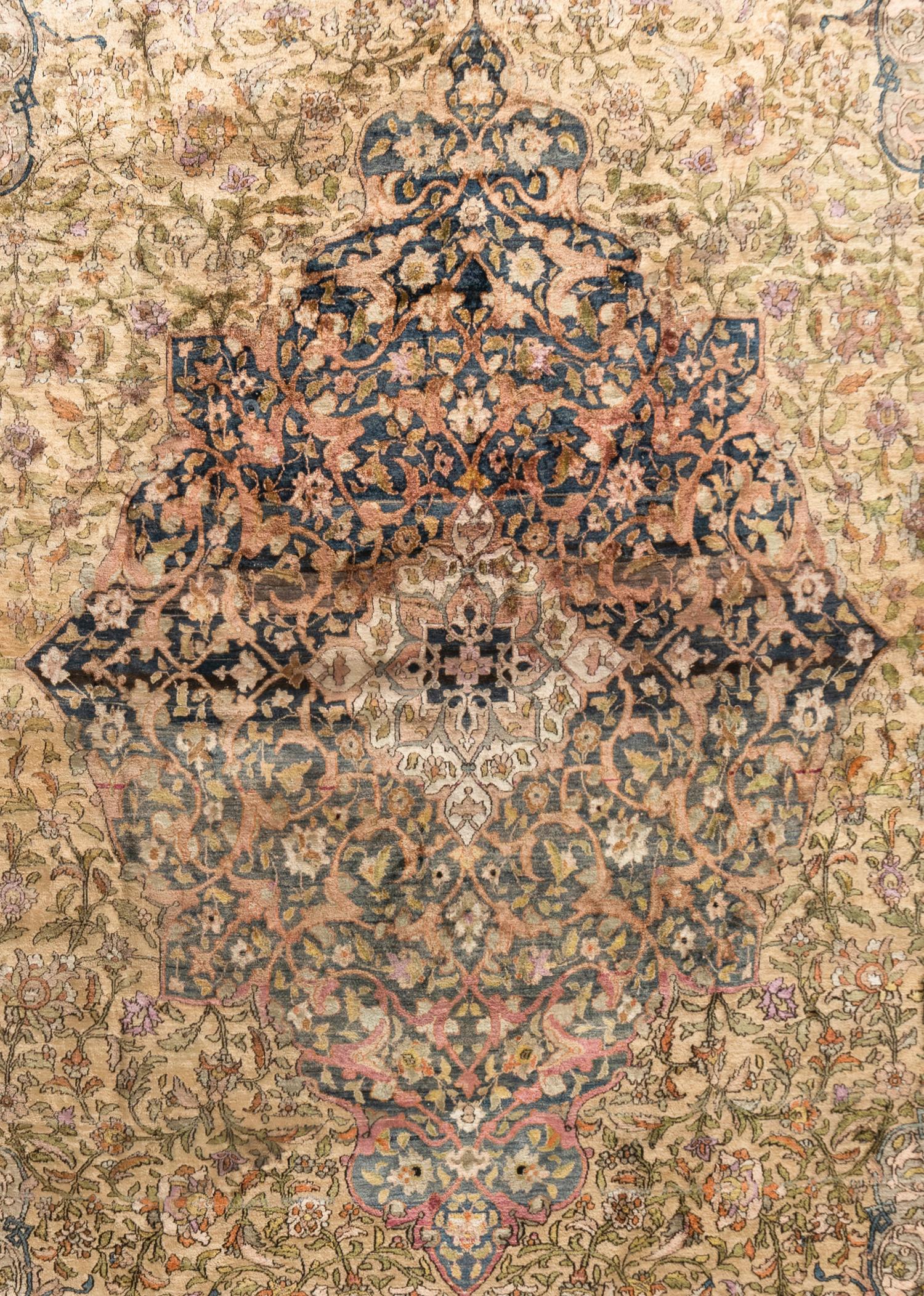 A Kashan Silk Carpet