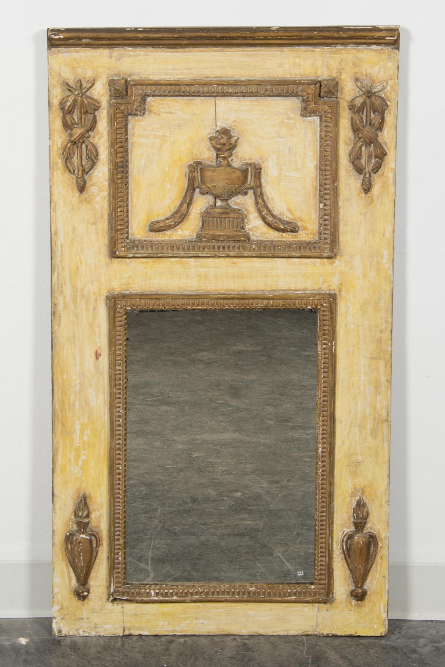 A Painted and Parcel Giltwood Mirror Height 41 x width 22 1/2 inches.